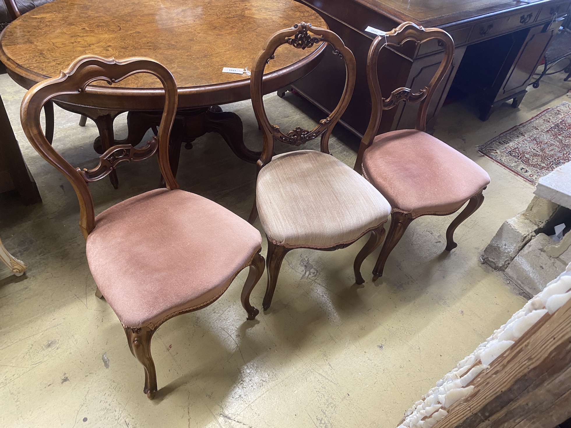 A harlequin set of six (4 plus 2) Victorian walnut dining chairs